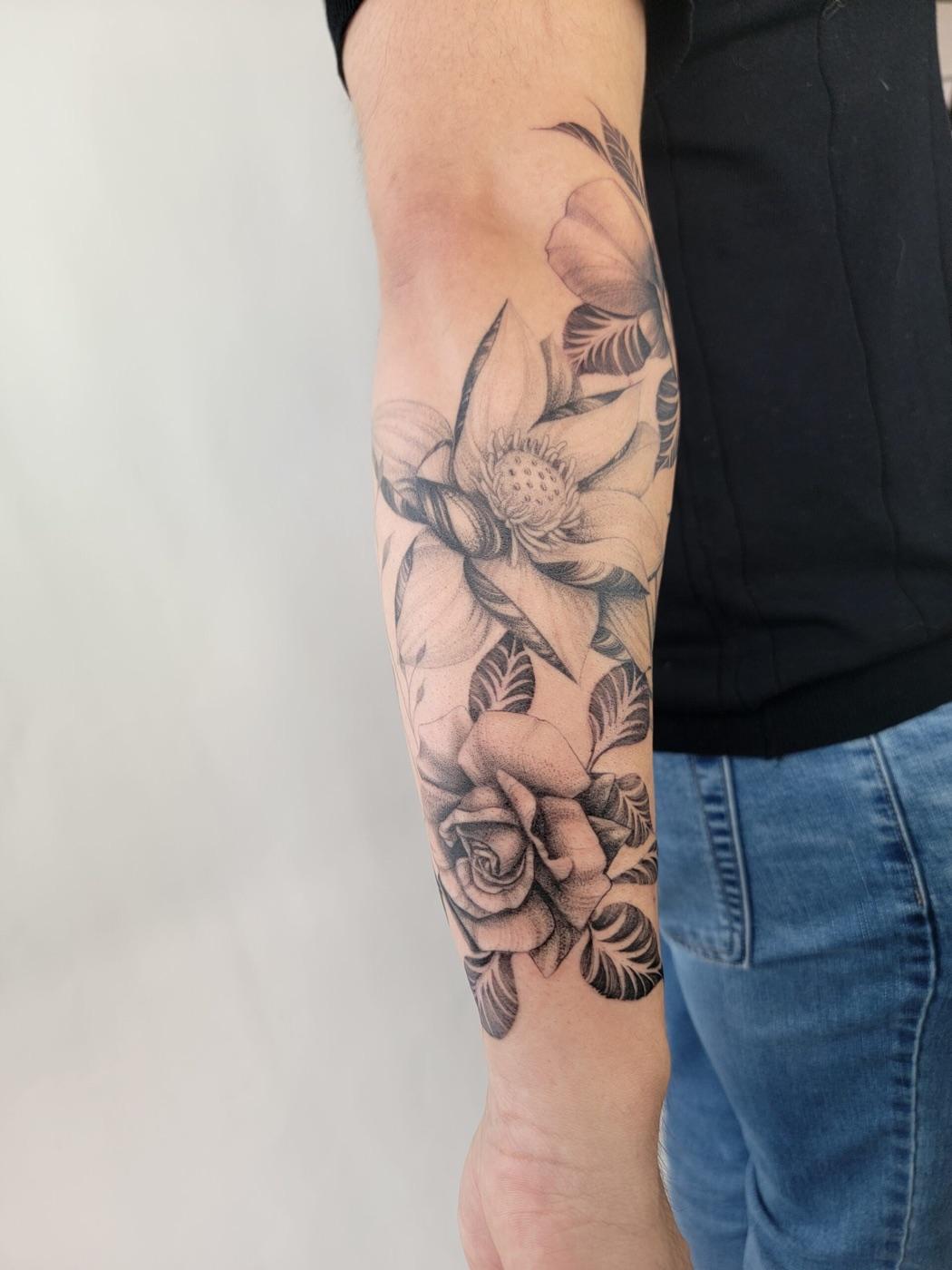 Black and grey floral tattoo