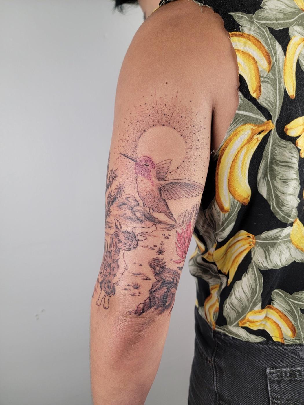 Hummingbird and desert scene tattoo