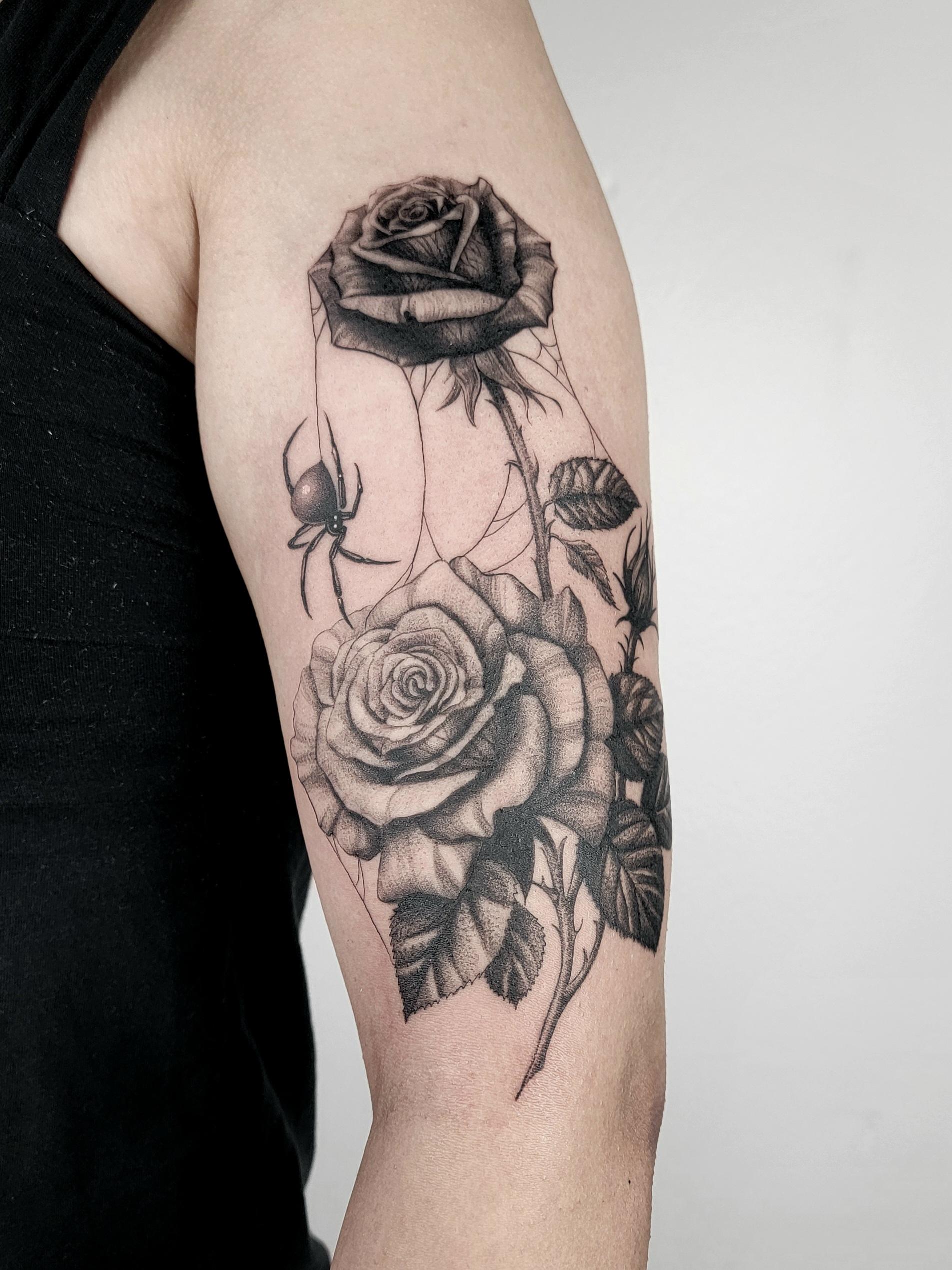 Rose tattoo with spiderweb and spider