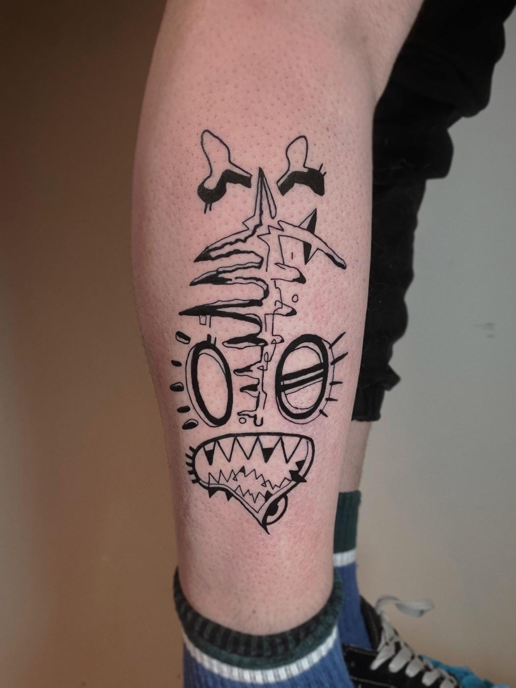 Abstract face tattoo