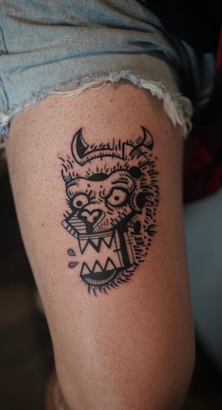 Abstract graphic face tattoo