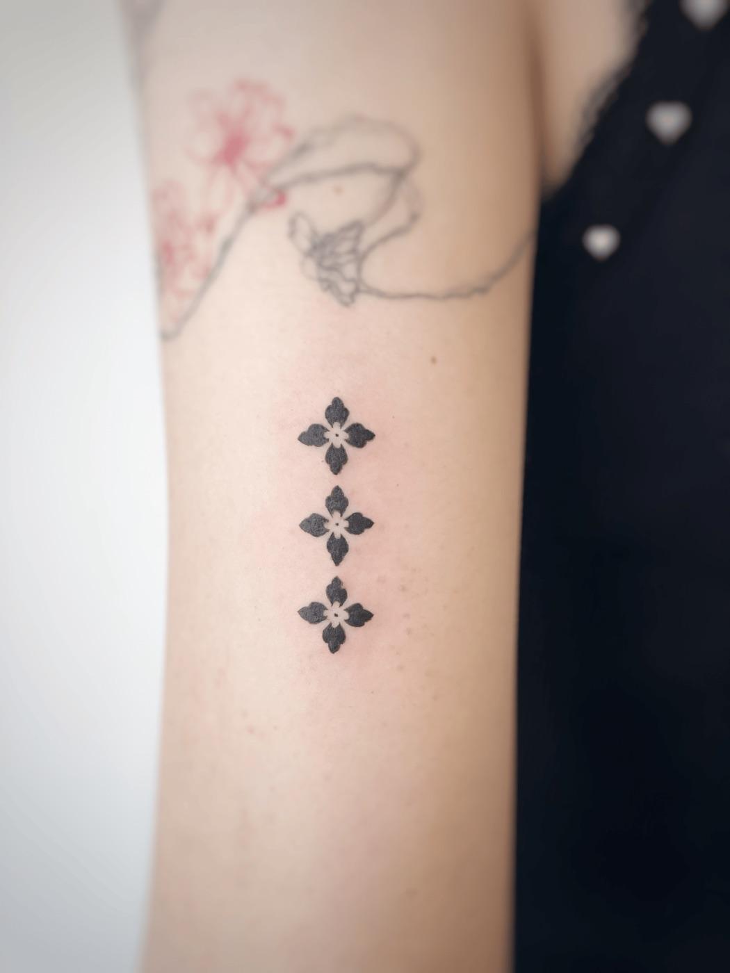 Geometric flower tattoo