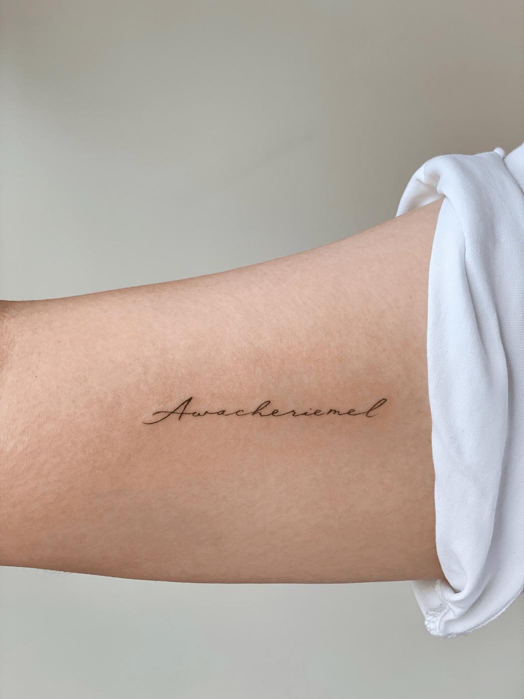 Fine line script tattoo