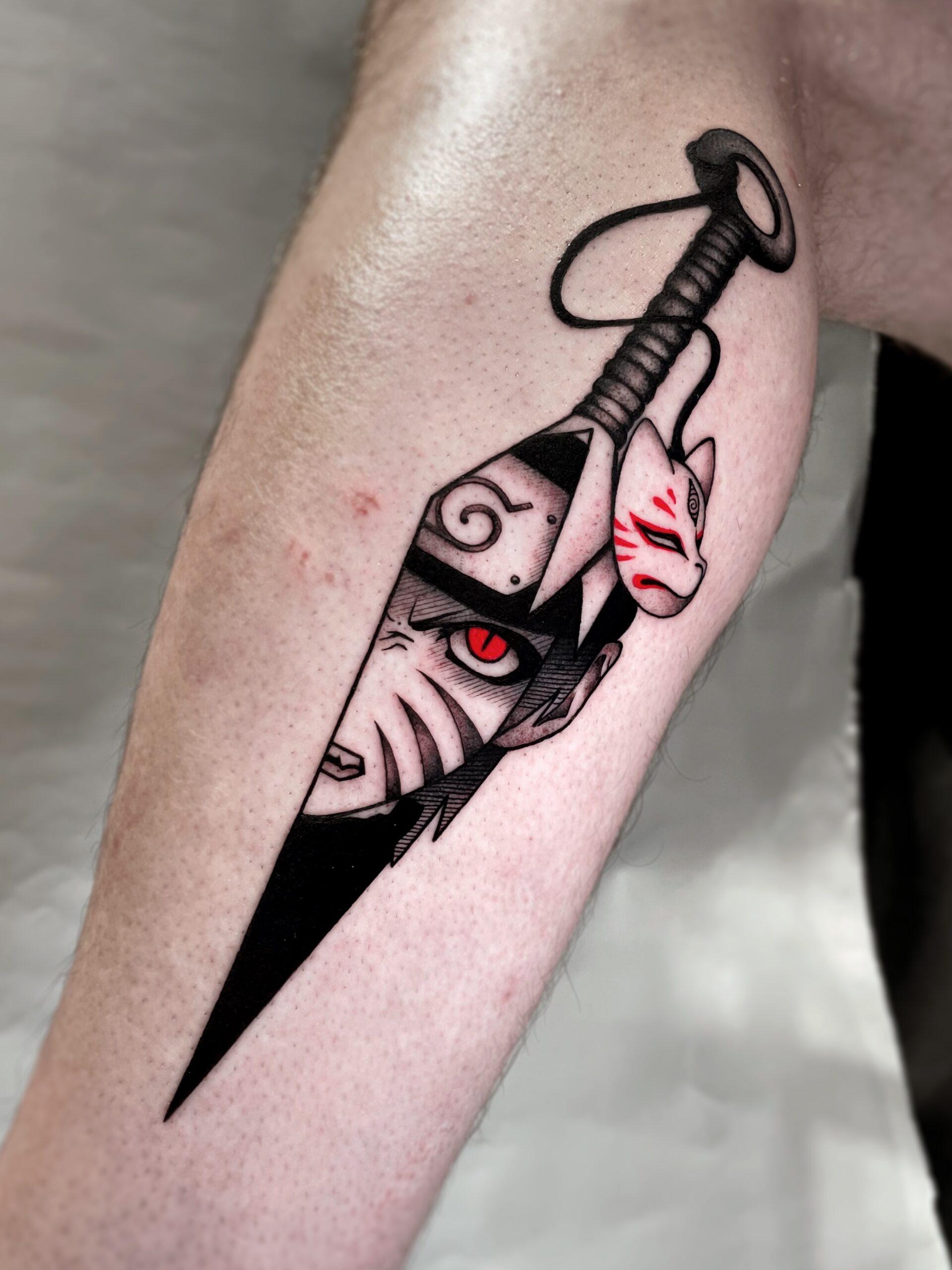 Dagger tattoo with a fox mask
