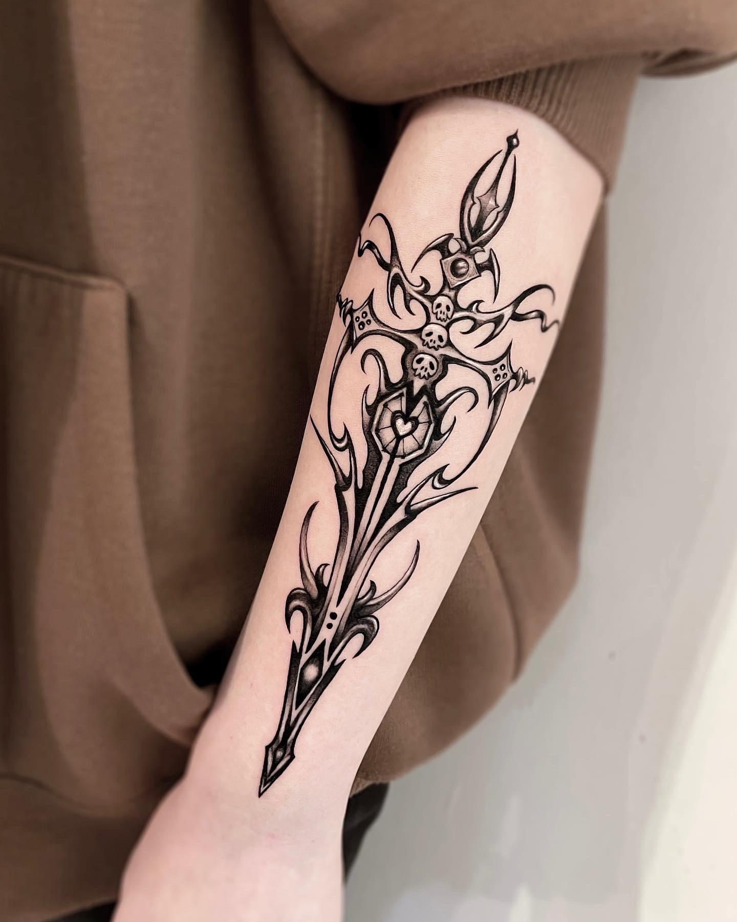 Ornate dagger tattoo