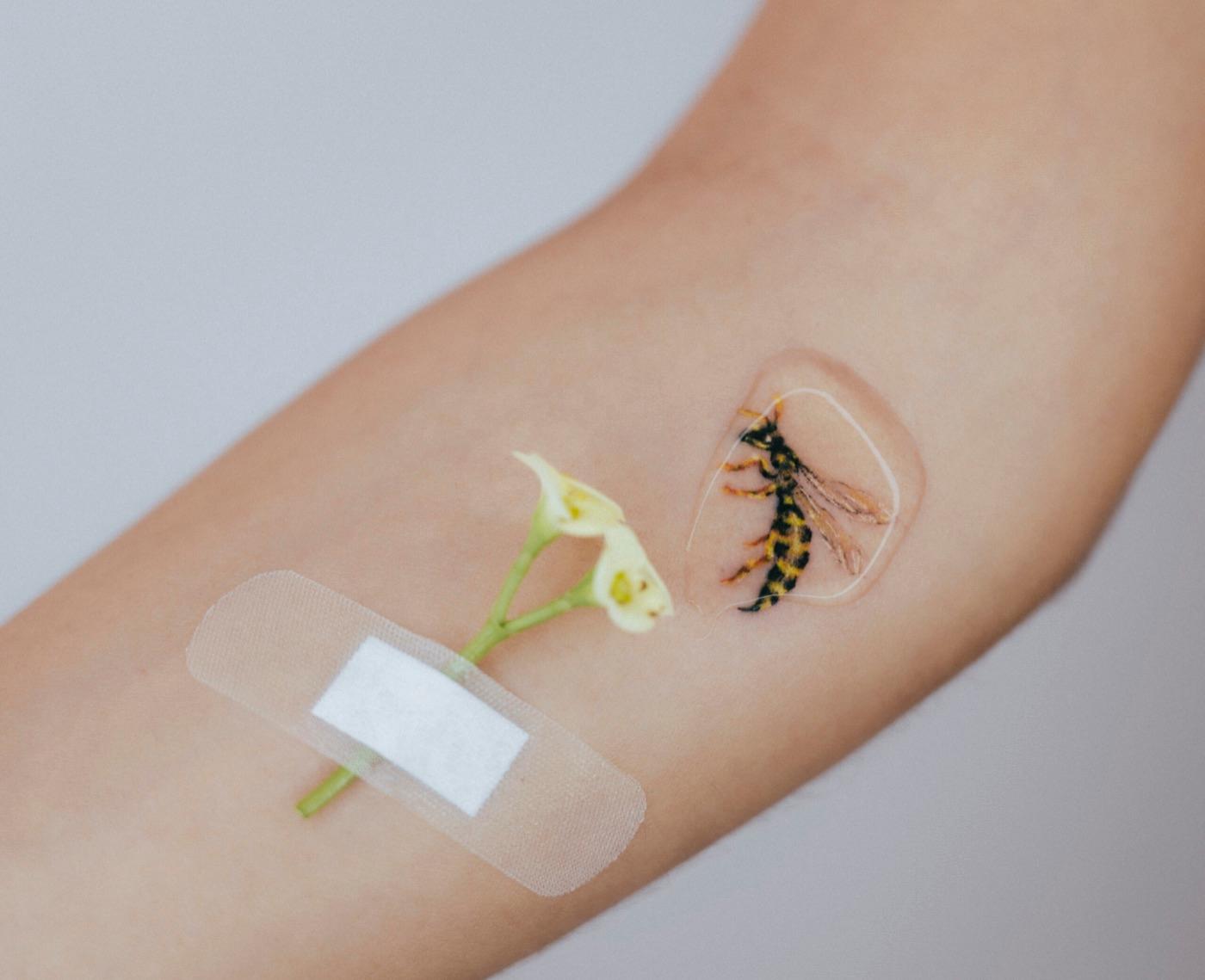 Striped insect tattoo