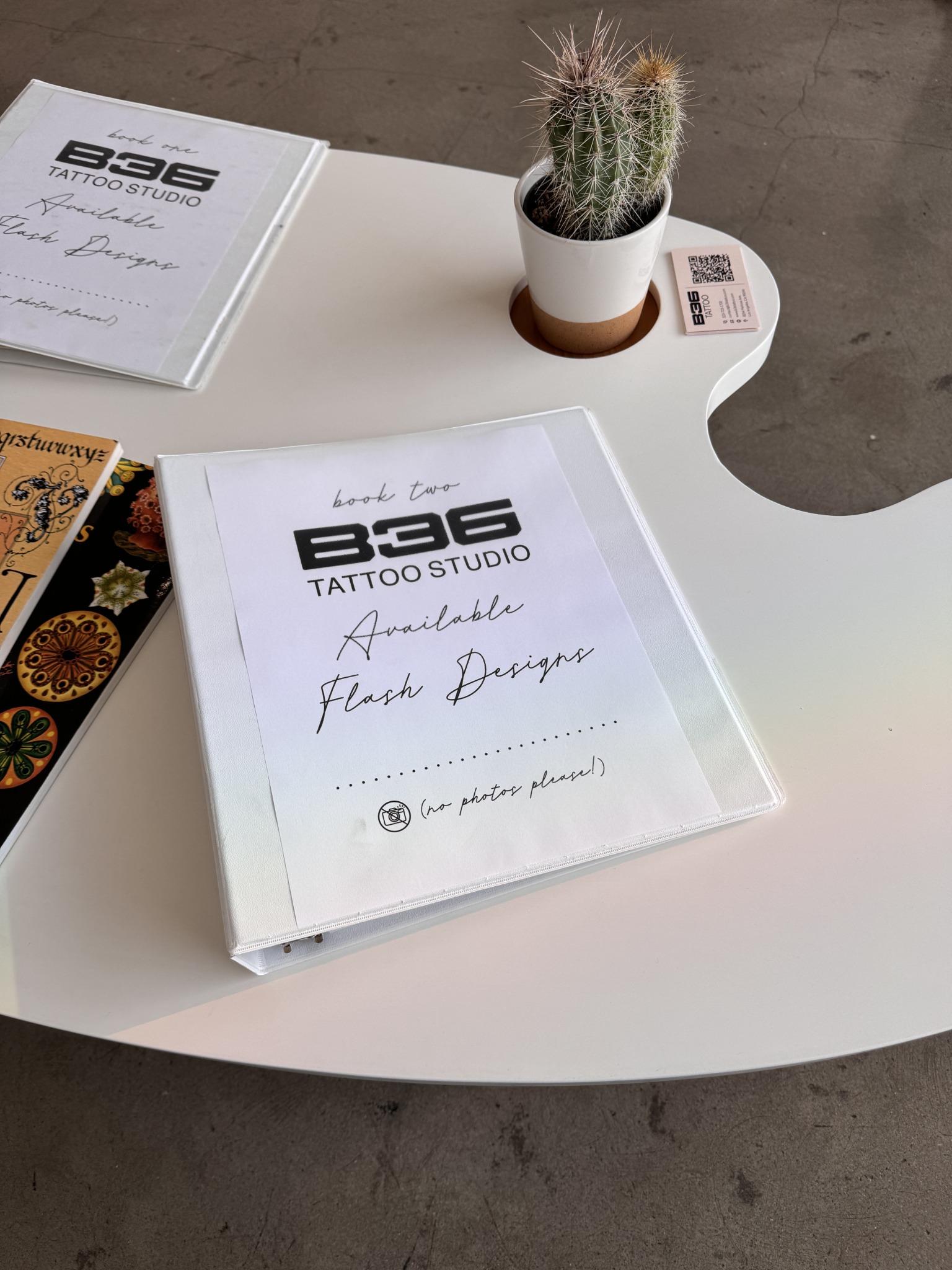 B36 Tattoo studio table with flash books