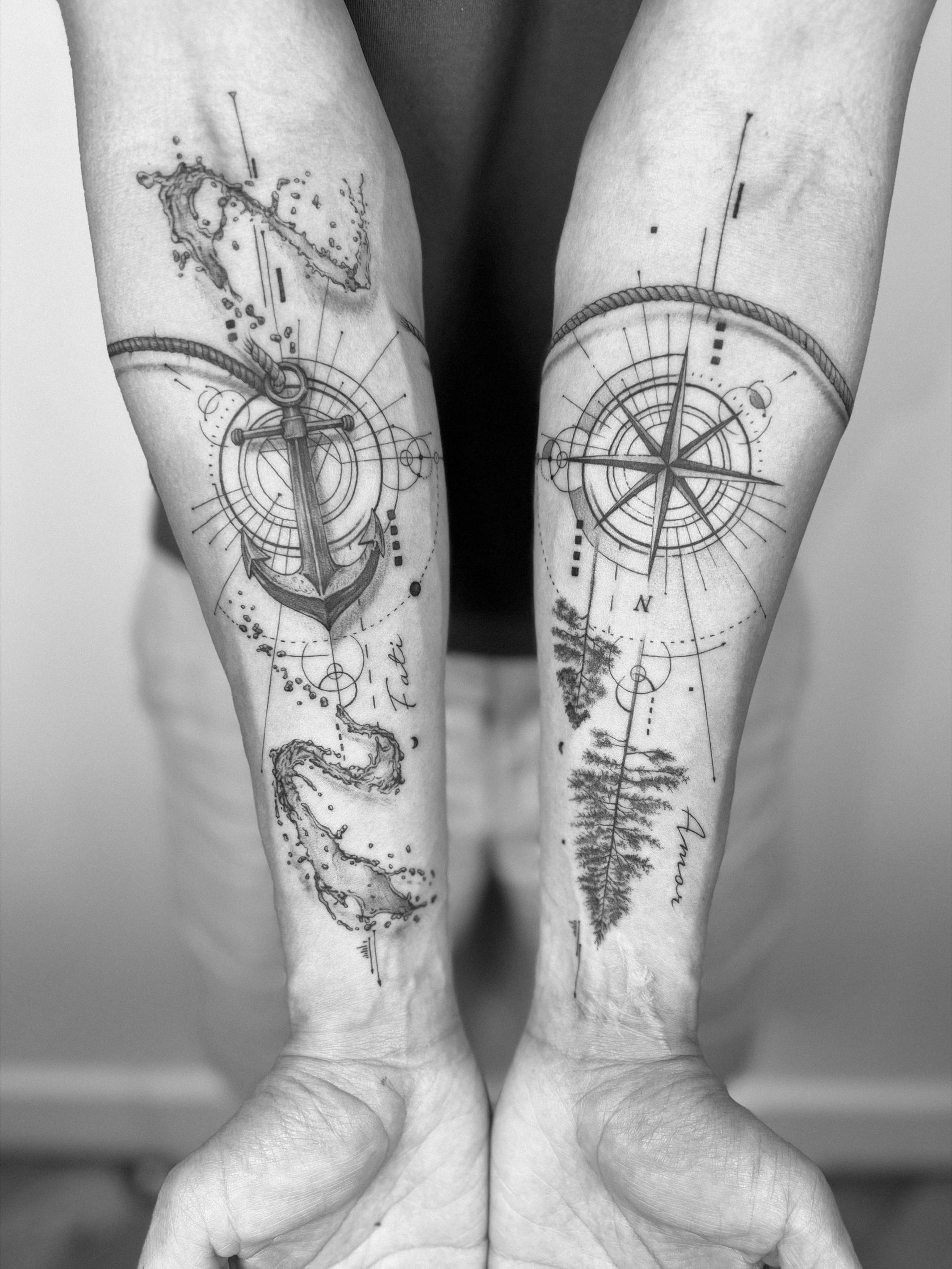 Black and grey anchor and compass tattoo
