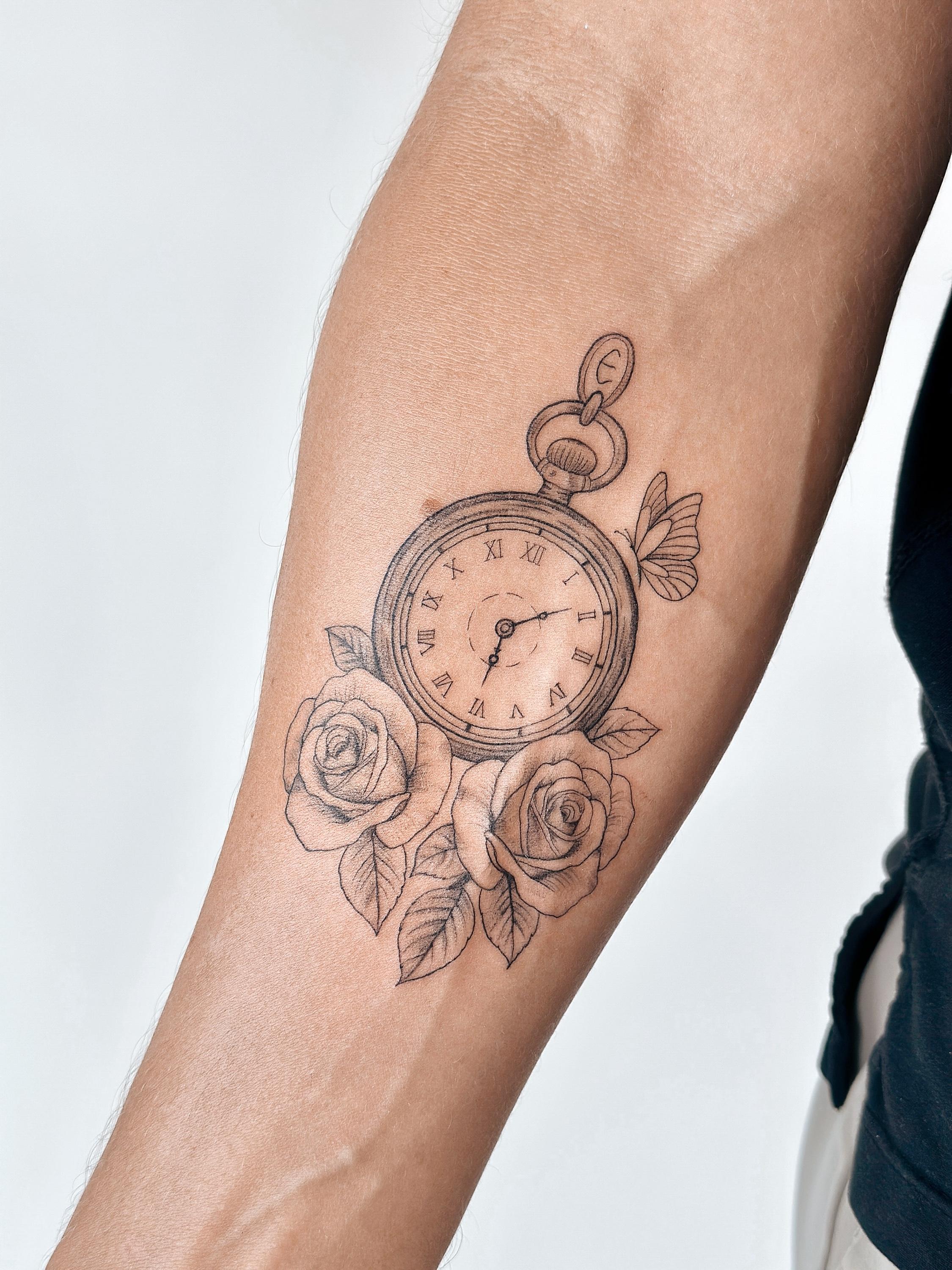 Black and grey pocket watch and roses tattoo