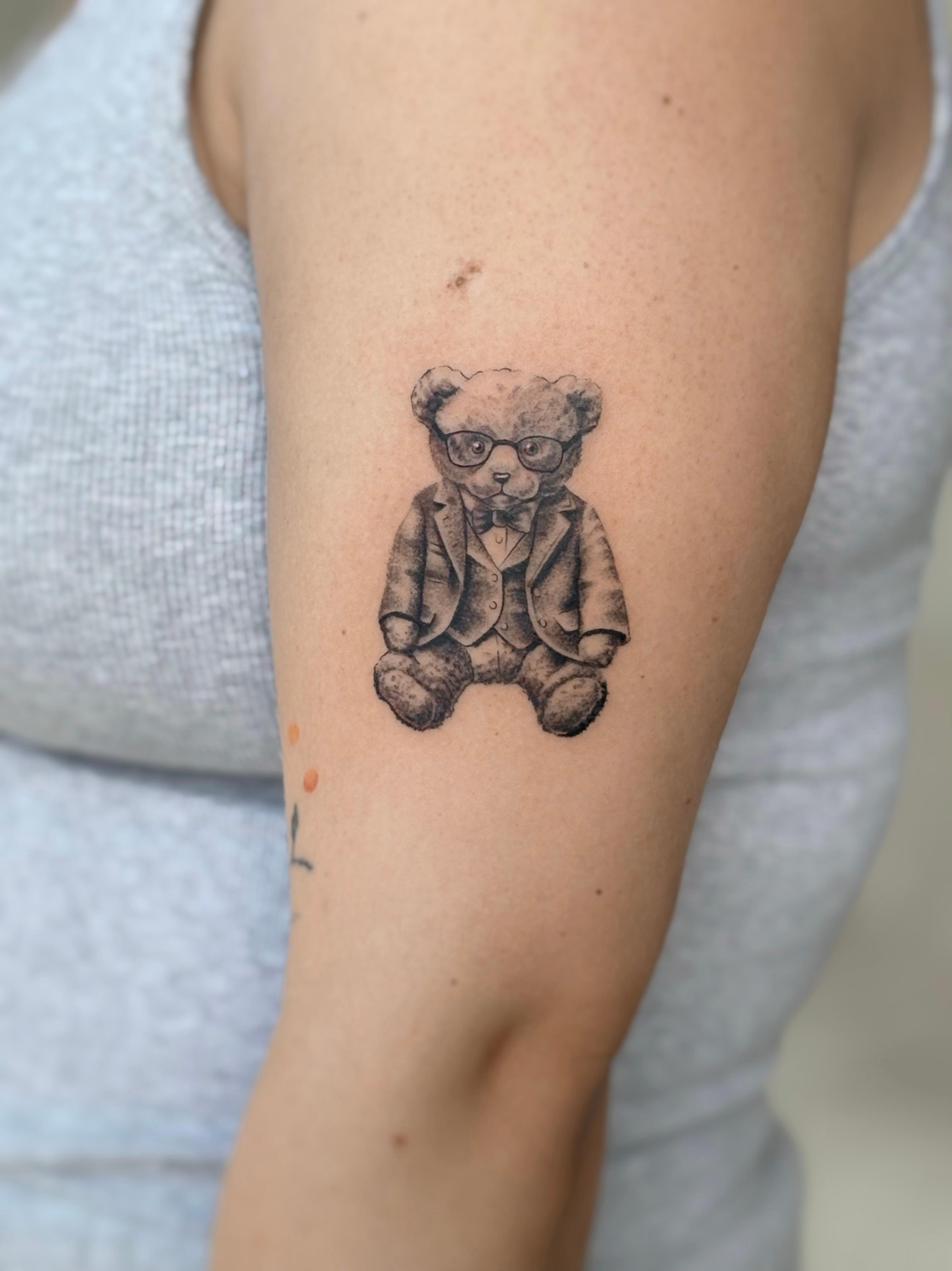 Black and grey teddy bear tattoo