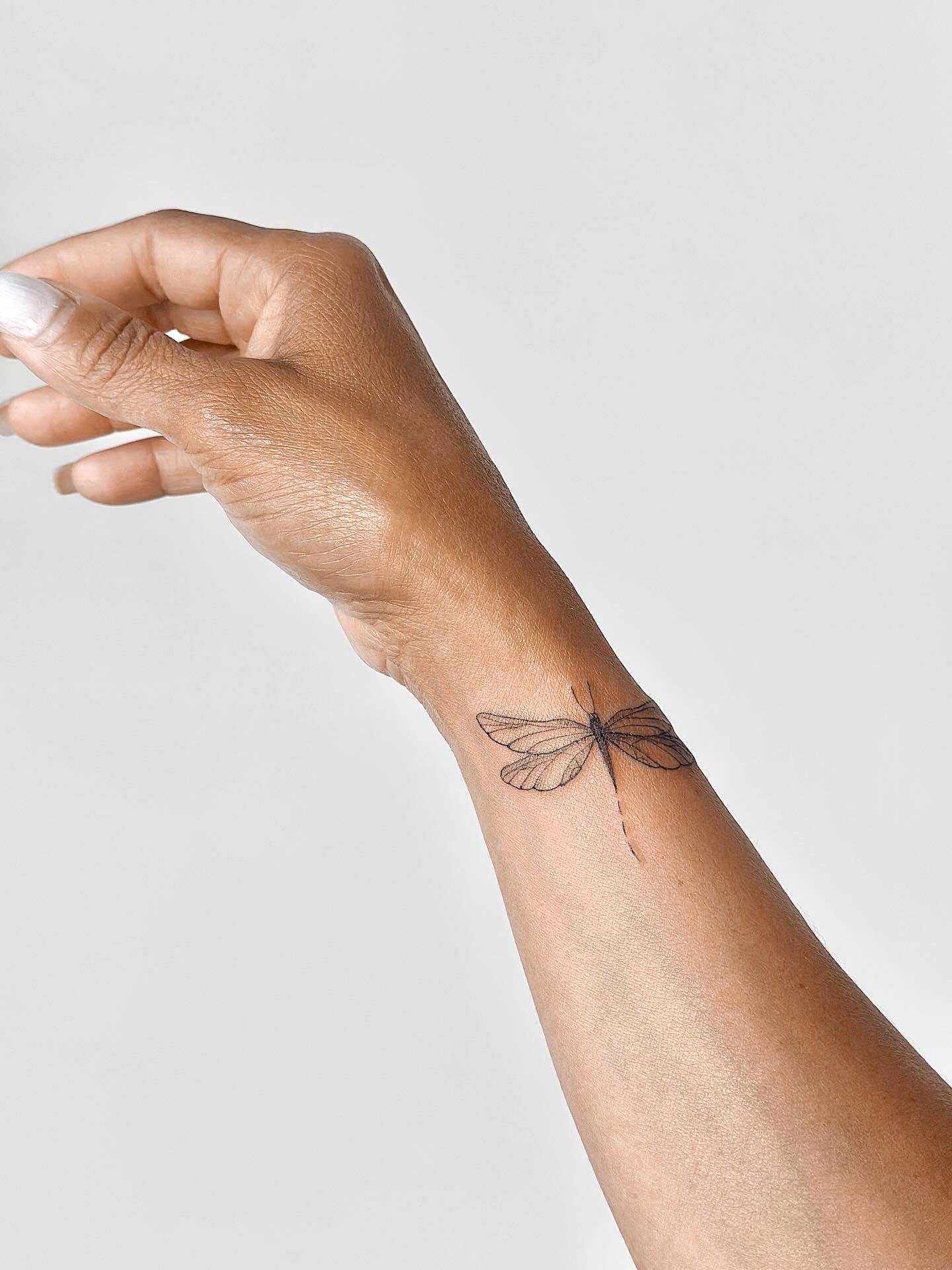 Fine line dragonfly tattoo