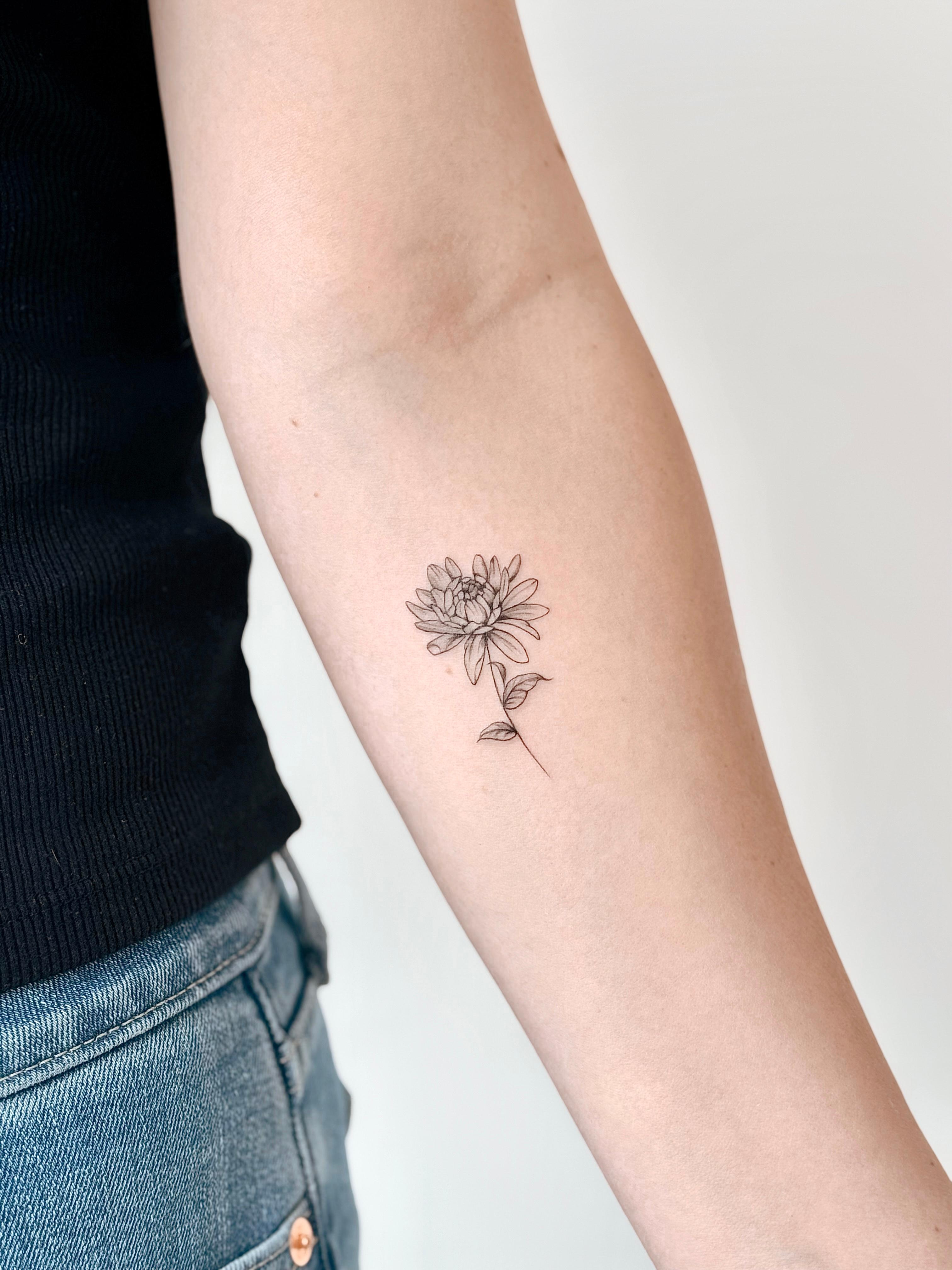 Fine line floral stem tattoo