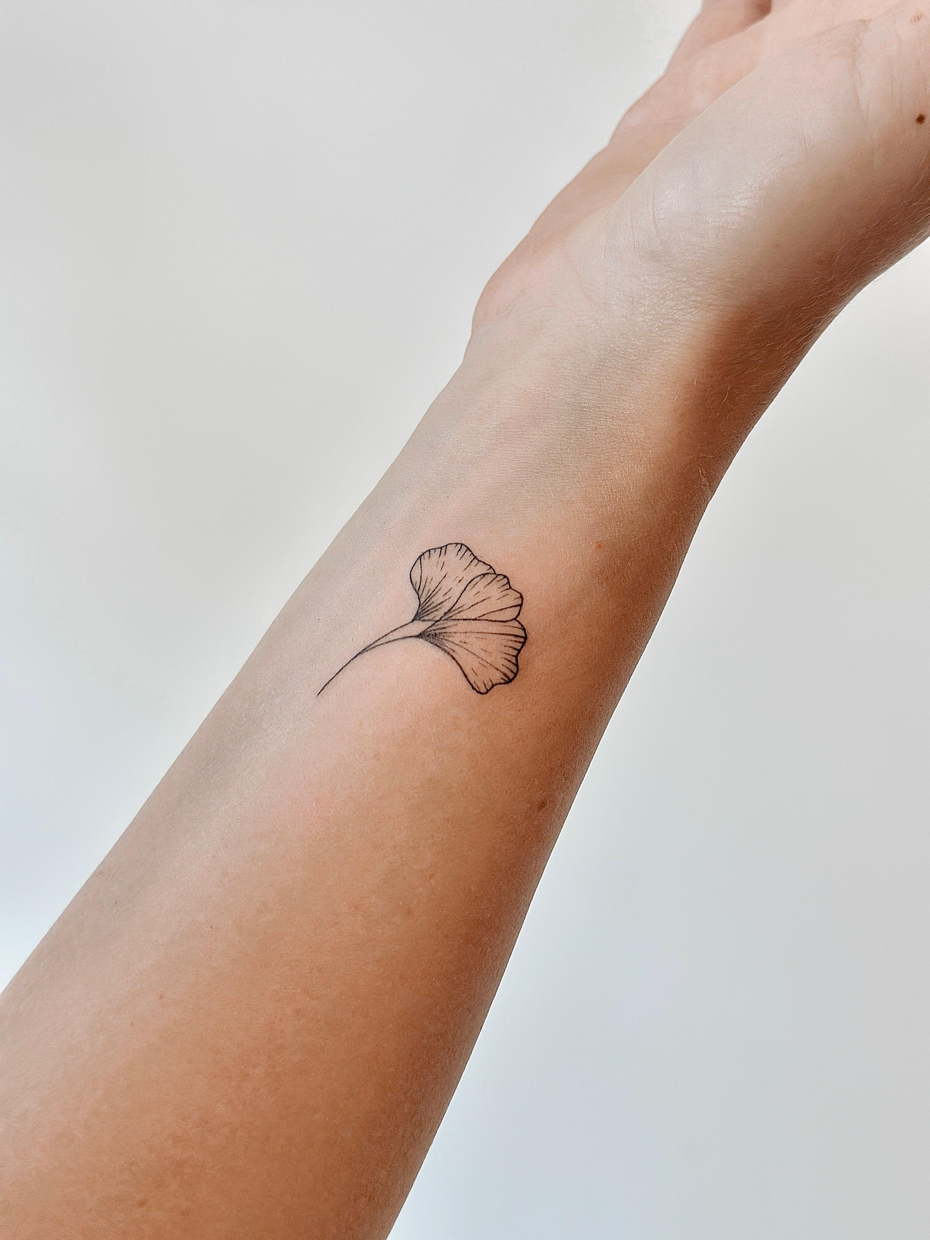 Fine line ginkgo leaf tattoo