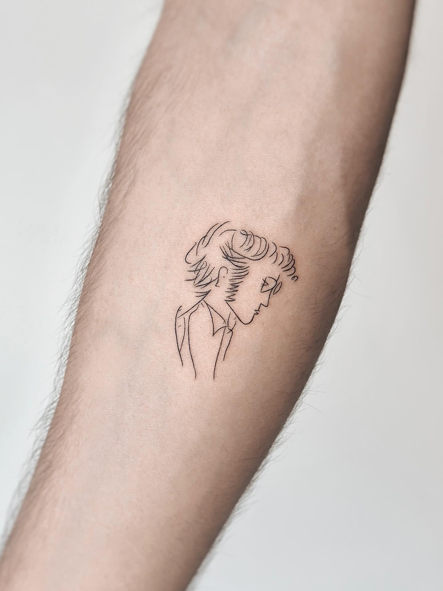 Fine line profile portrait tattoo