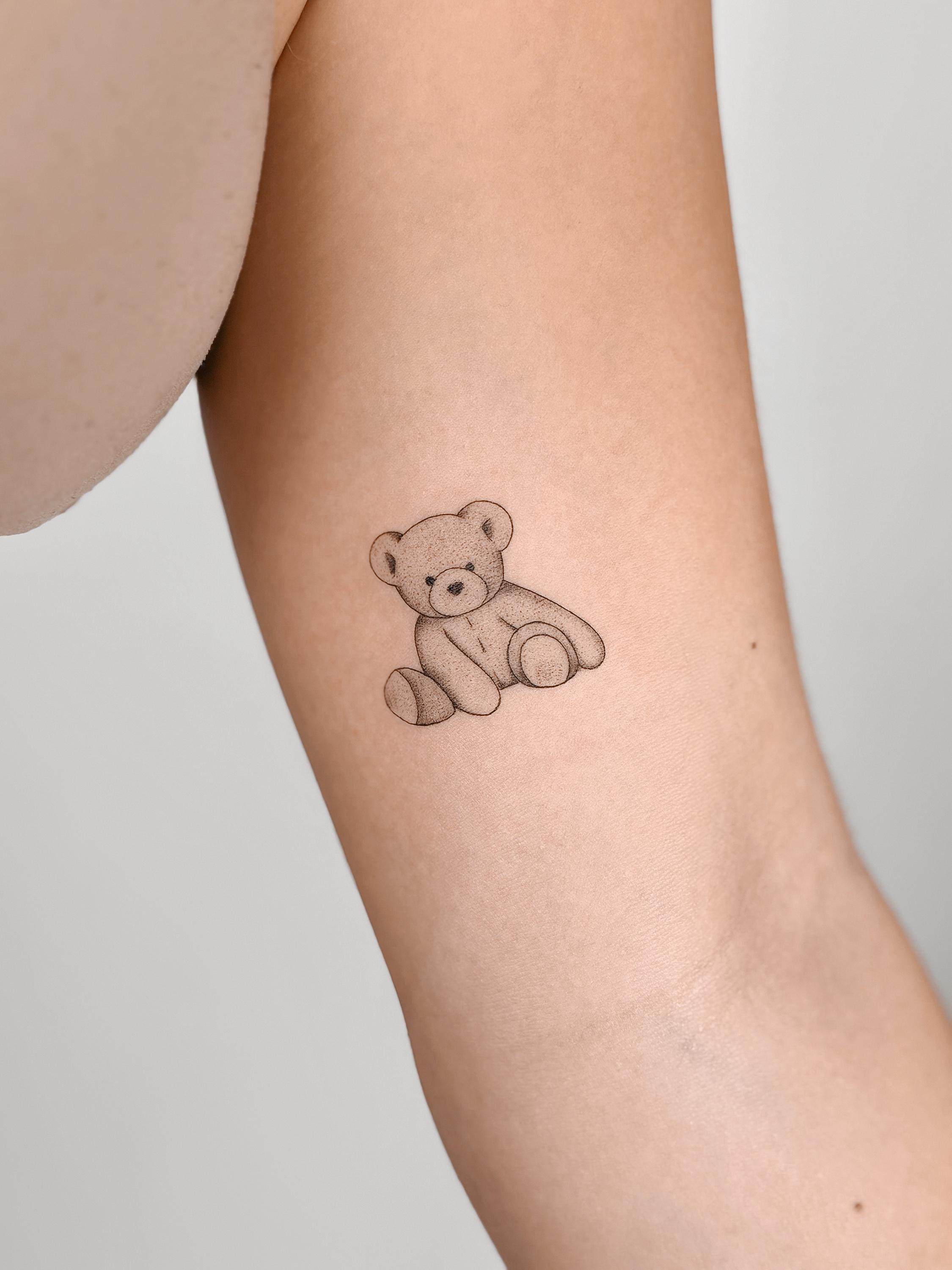 Fine line teddy bear outline tattoo