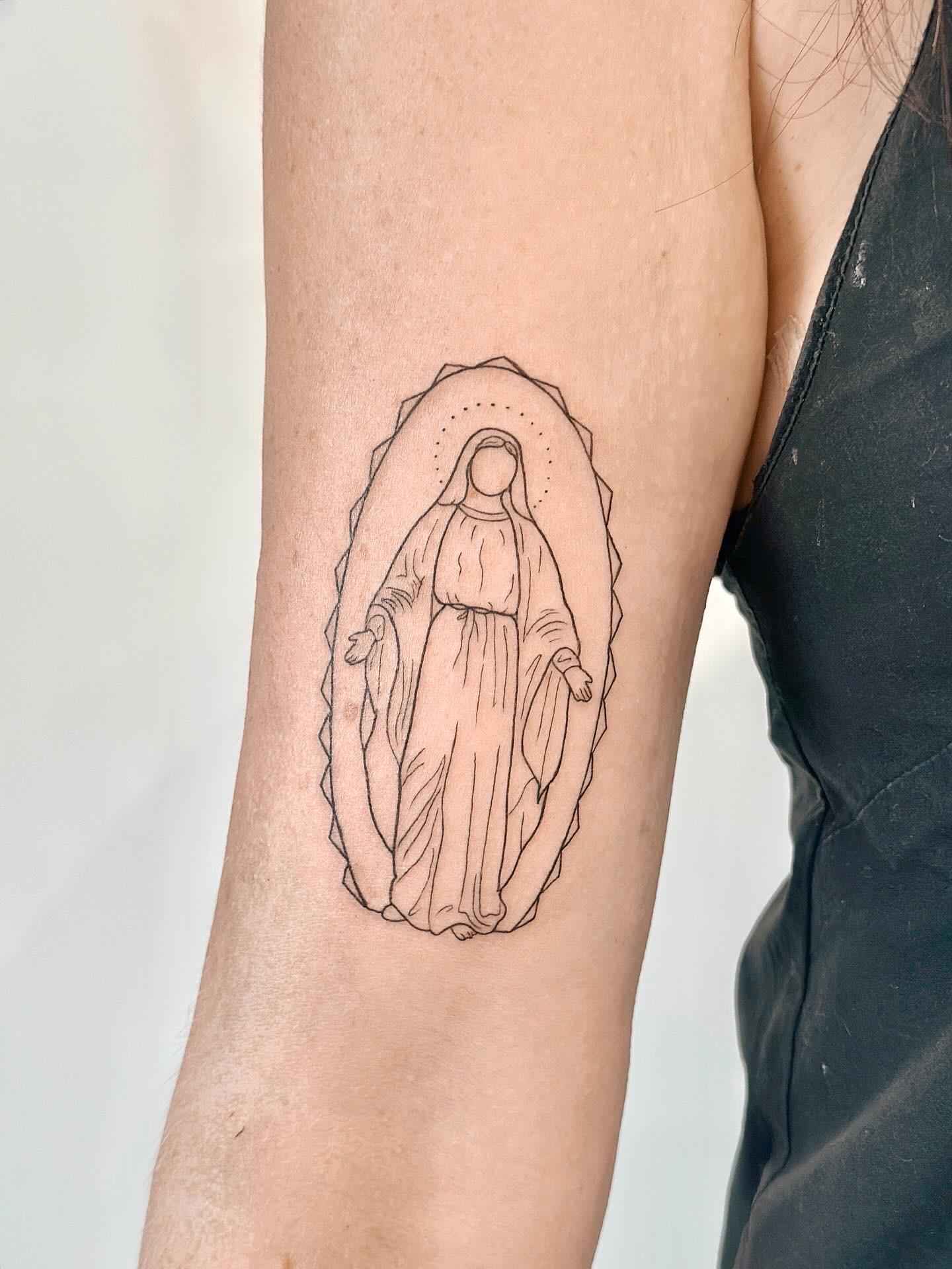 Fine line Virgin Mary tattoo