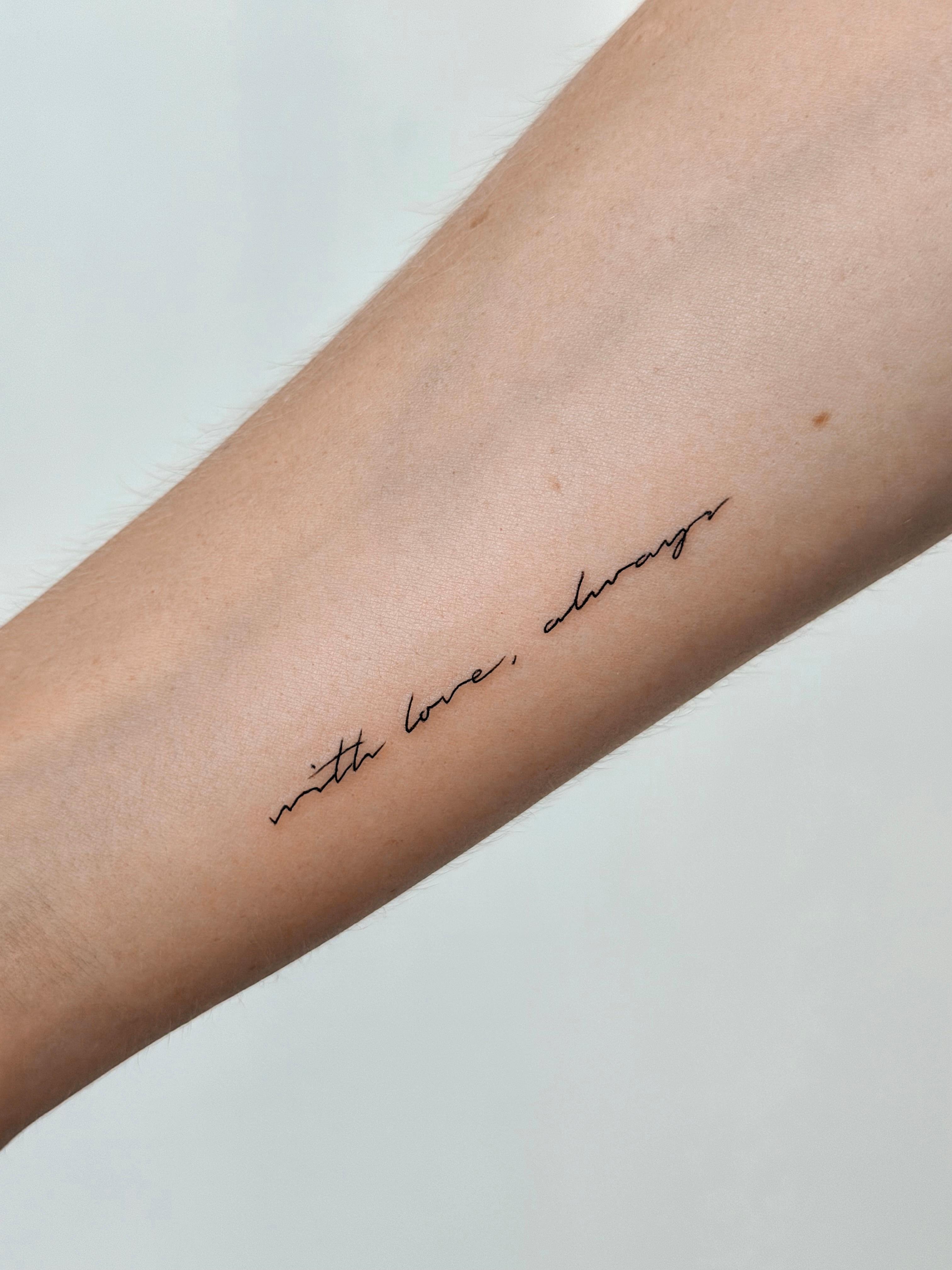 Fine line cursive tattoo reading with love, always