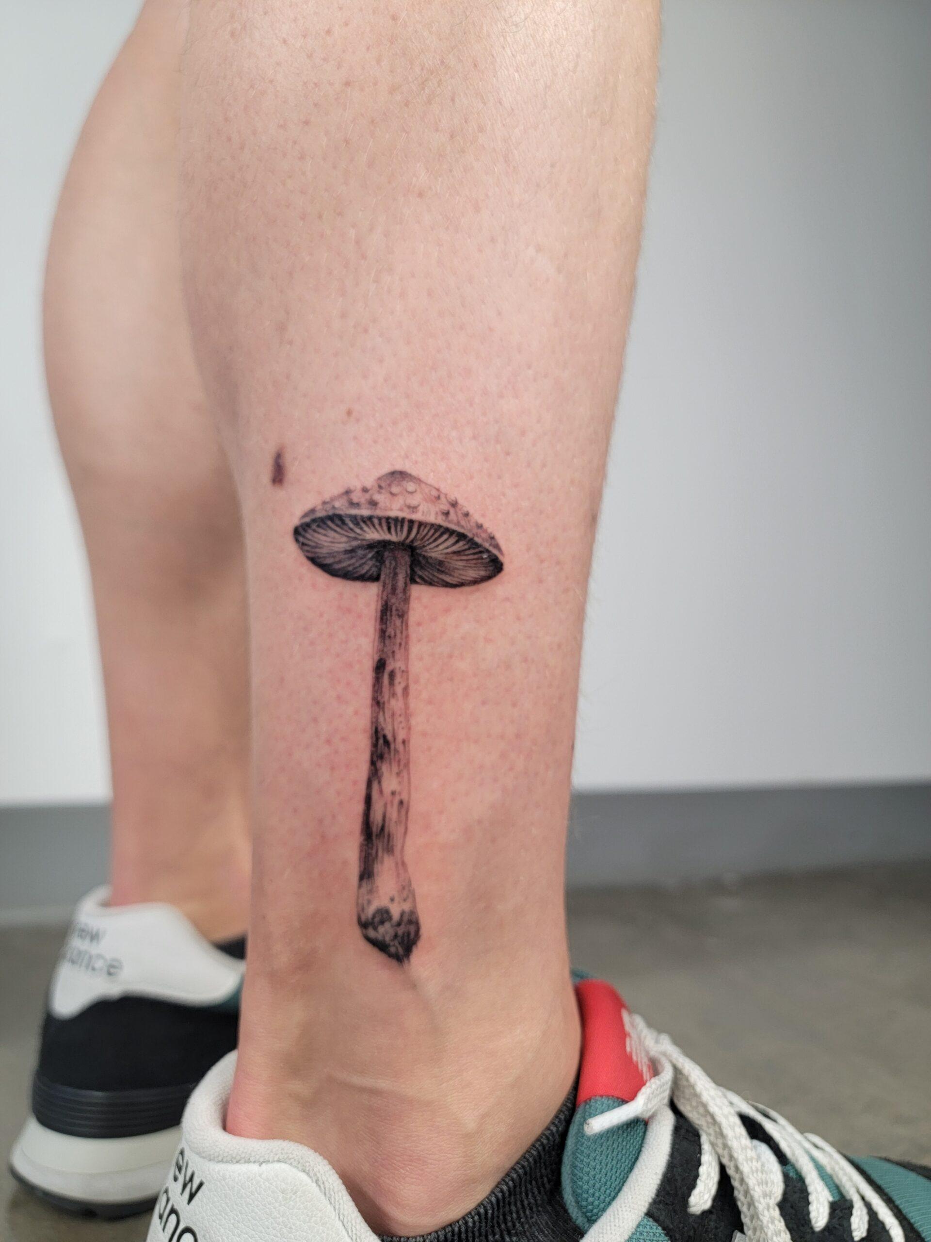 Black and grey realism mushroom tattoo